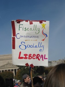 protest sigh says "fiscally conservative, socially liberal"