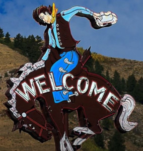 Image of a neon sign depicting a cowboy on a broncing buck
