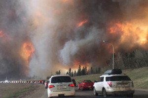 Photo by DarrenRD: Landscape view of wildfire near Highway 63 in south Fort McMurray Ft. McMurray residents evacuating from 2016 mega wildfire