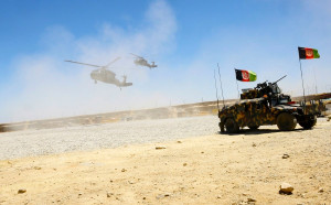 Two Blackhawk helicopters landing at an undisclosed Afghan base