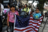RadioActivist - kids hold the US flag in a parade