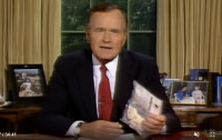 Then-President George H. W. Bush holding a bag of crack cocaine