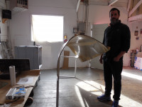 Sean Healy and his sculpture "Slow Roll."